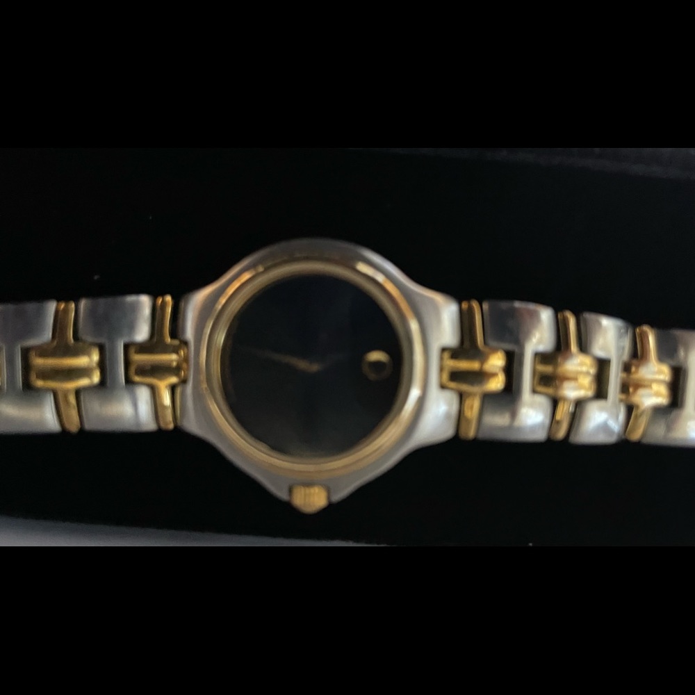Movado Elegant gold and silver watch. For everyday or dressing things up.